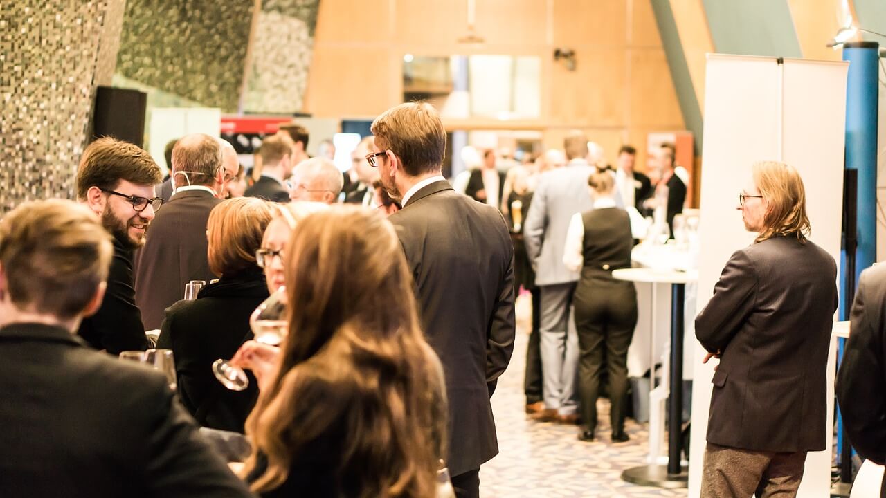 Innovators collaborating at a conference